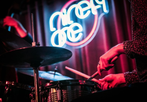 Neon logo signage and brand identity design for Ninety One Living Room on Brick Lane in Shoreditch East London