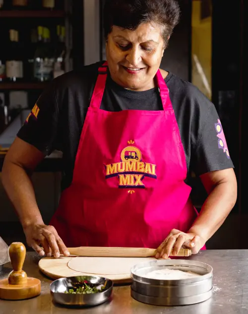 Custom aprons with logo and brand identity design for Mumbai Mix