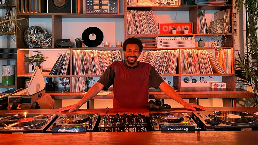 Hikko Mori DJ performing at Cafe 1001 custom vinyl DJ booth and rotary mixer